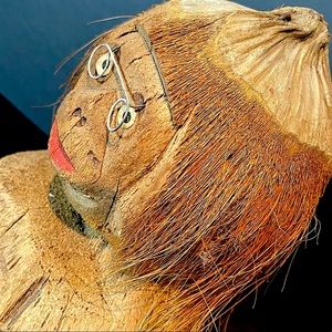 vintage coconut sculpture with glasses